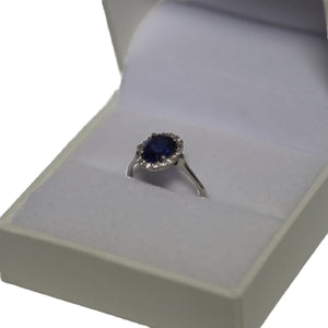 18ct White Gold Oval Blue Sapphire Halo Cluster Ring
