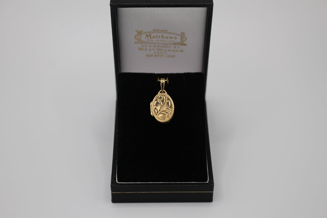 9ct gold locket with leaf engraving