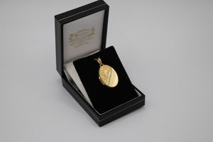 9ct gold locket with corner leaf design