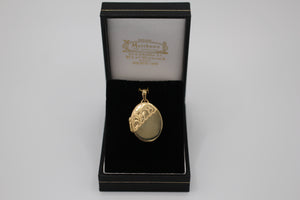 9ct gold locket with corner leaf design